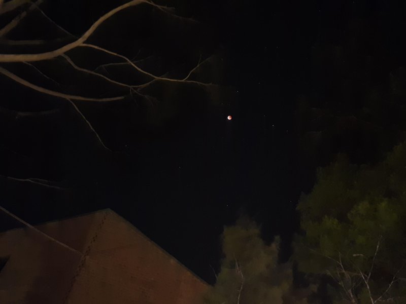 Super moon lunar eclipse above Sylvia Brose Hall
