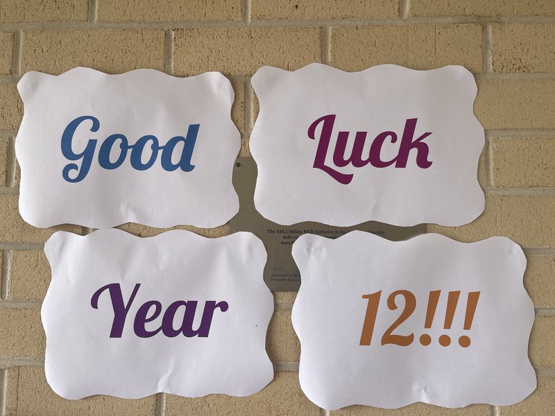 Primary students make 'Good Luck' poster for Year 12 students as they commence the HSC